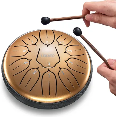 Shows how to hold and play the steel tongue drum with the included mallets, helping shoppers understand proper use and technique. Demonstrates the product actively being played to show how it…