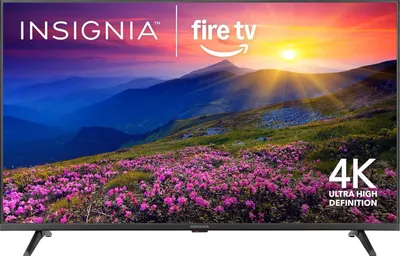 Shows the Insignia Fire TV as the core product with a vibrant scenic display to communicate the visual quality and Fire TV integration. Uses a clean white background with subtle shadows beneath the…