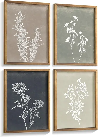 Shows the core sellable product—a set of four framed botanical art prints with white floral designs on varied neutral backgrounds—allowing shoppers to see exactly what they will receive. Displays…