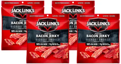 Shows multiple packages of the same bacon jerky product to communicate availability and potentially bulk purchase options. Displays the retail packaging prominently with visible product through the…