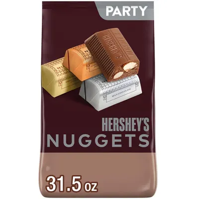 Shows the Hershey's Nuggets party-size package with multiple chocolate varieties visible, communicating the product's variety and party-size quantity to shoppers. Displays the retail packaging…