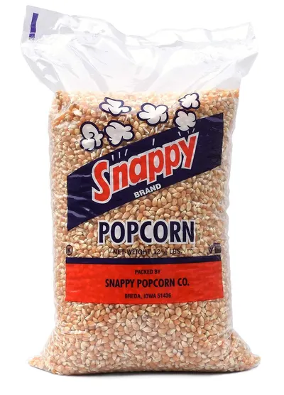 Shows the core product—a large bag of unpopped popcorn kernels—clearly displayed so shoppers can see the brand, quantity, and what they are purchasing. Displays the retail packaging with brand name,…