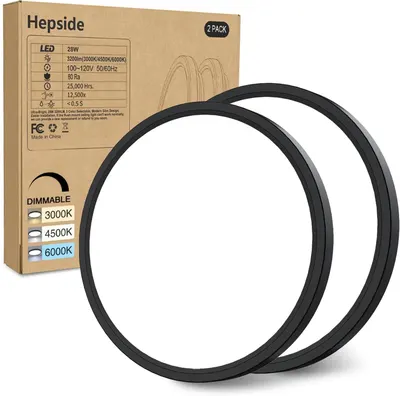 Shows the core product—two black circular LED flush mount ceiling lights—alongside their retail packaging to communicate what the buyer will receive. Displays the physical retail packaging with…