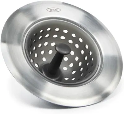 Displays the core product clearly on a white background to show the stainless steel construction and perforated basket design for catching food debris.