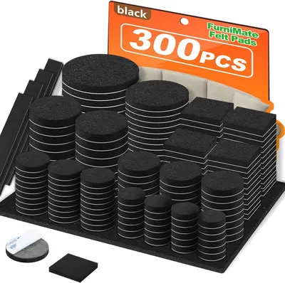 Shows the complete set of 300 black felt pads in various shapes (round, square, rectangular) to communicate the quantity and variety included in the purchase. Displays the orange retail packaging…