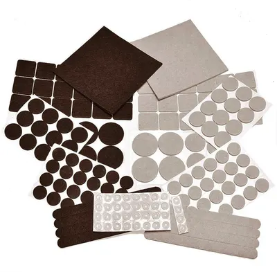 Shows the complete assortment of felt furniture pads in various shapes, sizes, and colors to communicate the versatility and comprehensive protection options included in the set. Displays all the…