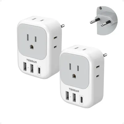 Shows the core product clearly on a white background, displaying two identical travel adapters with their European plug attachments to communicate what the buyer will receive. Demonstrates that the…