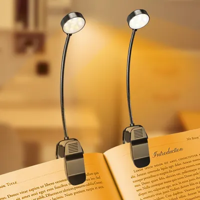 Shows the core product—a pair of clip-on LED book lights with flexible goosenecks—demonstrating their design and how they attach to a book for hands-free reading. Demonstrates the product actively…