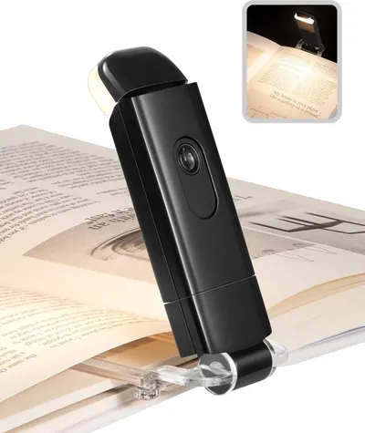 Shows the core product, a clip-on book light, clearly displayed to help shoppers understand what they are purchasing and how it attaches to books or other materials. Demonstrates the product in use,…
