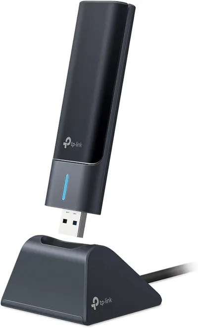 Displays the core product, a TP-Link USB WiFi adapter with its included stand, showing the sleek design and USB connectivity to help shoppers understand what they are purchasing. Shows that the…