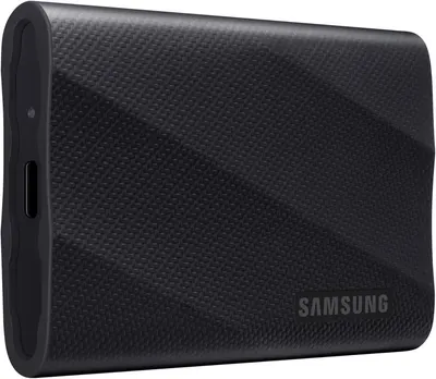 Displays the Samsung portable SSD with its textured carbon fiber finish to communicate premium build quality and portability for shoppers seeking reliable external storage.