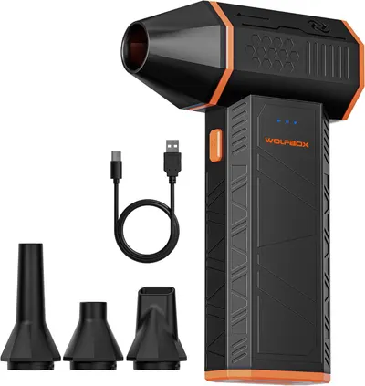 Displays the core WOLFBOX product with its rugged black and orange design to show shoppers what they will receive. Shows all included accessories—three different nozzle attachments and a USB…