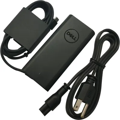 Shows the complete Dell power adapter unit with both the power brick and included cables, allowing shoppers to see exactly what they will receive and verify compatibility with their device.…