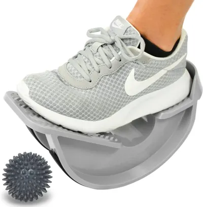 Demonstrates the product in active use for balance and stability training, showing shoppers how the rocker platform works with a foot on it to communicate its exercise functionality. Shows that the…