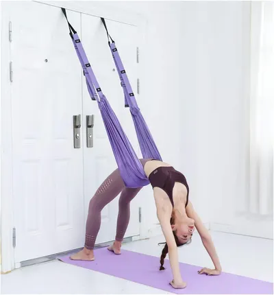 Shows a person actively using the aerial yoga swing to demonstrate how the product works and provide scale context for shoppers considering the product for their own fitness practice. Demonstrates…