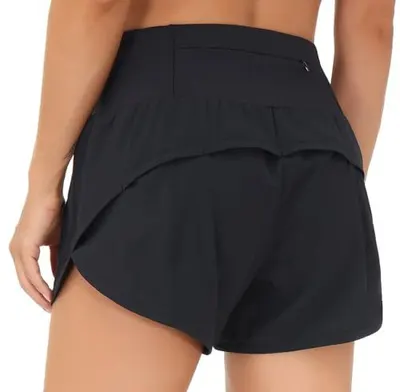 Shows how the athletic skirt fits on a real person from behind, demonstrating the coverage, length, and silhouette to help shoppers visualize fit and style. Demonstrates the functional layered…