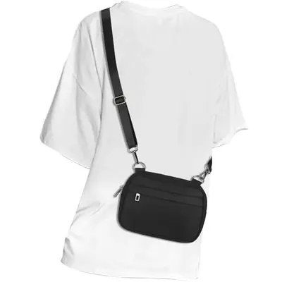 Shows how the crossbody bag looks when worn on a person, helping shoppers visualize the size, fit, and styling of the product on the body. Demonstrates the product's crossbody functionality and how…