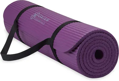 Shows the core product clearly - a rolled purple yoga mat with integrated carrying straps, allowing shoppers to see the product design, color, branding, and portability feature. Uses a subtle drop…