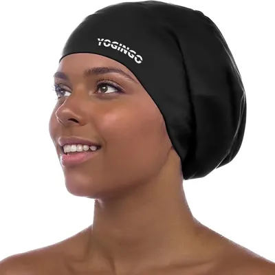 Shows the swim cap being worn by a model to demonstrate fit, coverage, and how it looks when in use, helping shoppers visualize the product on themselves.…