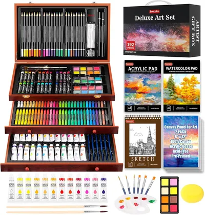 Displays the comprehensive deluxe art set with all included supplies organized in a wooden case, alongside individual product components like pads, canvases,…