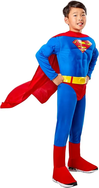 Shows the complete Superman costume on a child model to demonstrate fit, appearance, and included cape accessory, helping parents visualize how the costume…