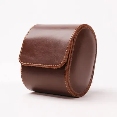 Displays the core product—a leather watch case or accessory pouch—in a clean catalog style to show its craftsmanship, material quality, and compact form factor.