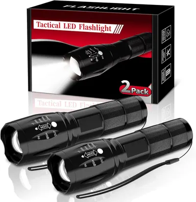 Shows the core product—two tactical LED flashlights—clearly displayed with their retail packaging to communicate what the buyer will receive. Displays the…