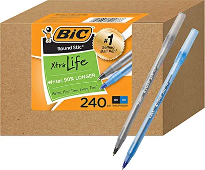 Shows the BIC Round Stic Xtra Life ballpoint pens in a 240-count bulk package alongside individual pen samples, communicating the product's extended writing…