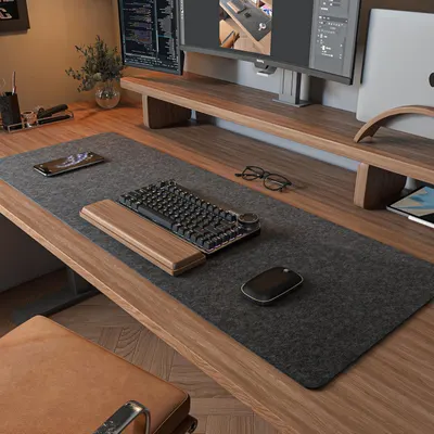 Shows the desk mat in a real-world office/workspace setting to help shoppers visualize how it fits into their own desk setup and complements their workspace…
