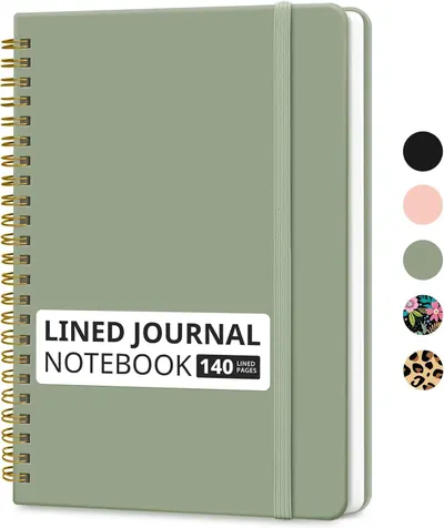 Shows the core product clearly—a sage green lined journal notebook—so shoppers can see the design, binding style, elastic band closure, and page count.…