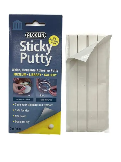 Shows the core product - white adhesive putty strips - alongside its retail packaging to communicate what the buyer receives. Displays the retail packaging…