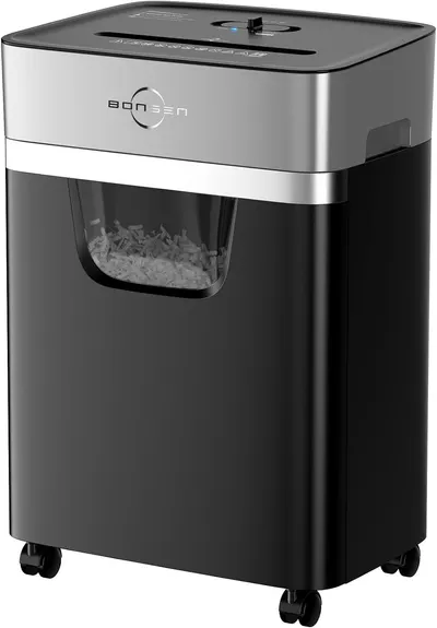 Shows the core paper shredder product with a clear view of its transparent collection bin containing shredded paper, demonstrating the product's functionality…