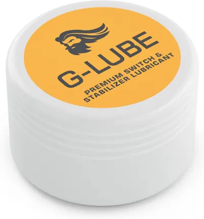 Displays the core product, a container of G-Lube premium switch and stabilizer lubricant, clearly showing the brand name and product type to help shoppers identify what they are purchasing. Shows…