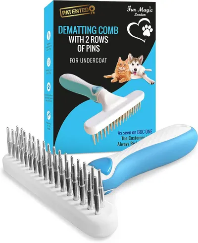Shows the core pet grooming product clearly with its retail packaging to communicate what the buyer will receive and its key feature of dual-row pin design for undercoat dematting. Displays the…