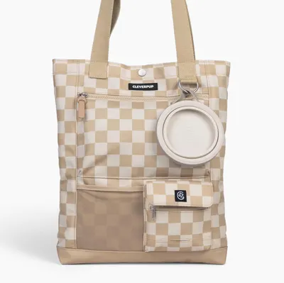 Displays the core product—a pet tote bag with integrated storage pockets and an attached collapsible bowl—to show shoppers exactly what they will receive. Highlights that a collapsible bowl is…