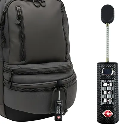Shows the core product—a TSA-approved combination lock with cable—alongside a backpack to demonstrate its intended use for securing luggage and travel bags. Includes a backpack as a contextual…