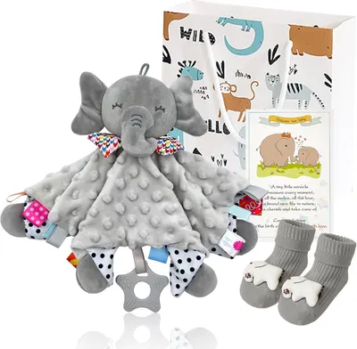 Displays the complete baby gift set including elephant lovey, teether, socks, greeting card, and gift box to show shoppers everything included in the purchase. Shows all the included accessories and…