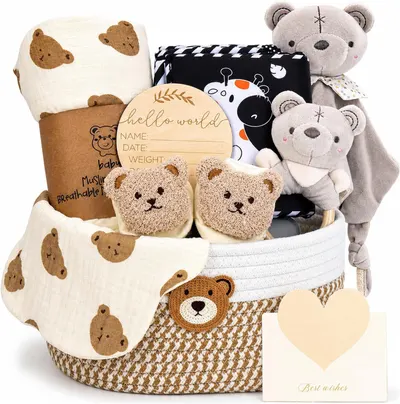 Displays a complete baby gift basket with multiple items including blankets, plush toys, baby slippers, and a wooden milestone plaque to show shoppers the full contents of the gift set they will…