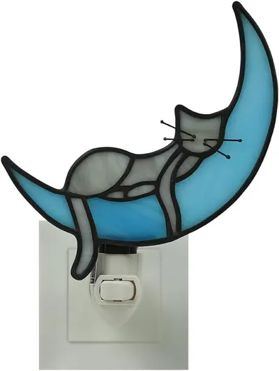 Shows the core product, a decorative night light featuring a cat on a moon design, clearly displaying its artistic stained-glass style and form to help…