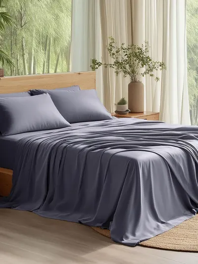 Showcases the bedding set's elegant drape and smooth, silky appearance to communicate premium quality and comfort for the bedroom. Displays the bedding in a…
