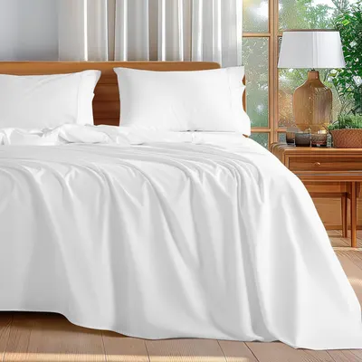 Displays the core product, a white bedding set including duvet cover and pillowcases, to show shoppers the clean, elegant appearance and how it looks when…