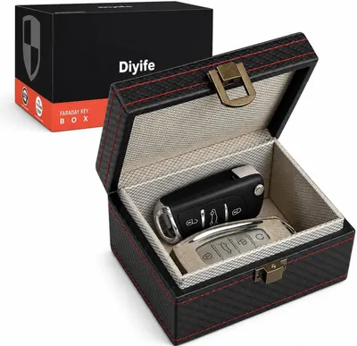 Shows the core product—a Faraday key box—with its protective storage case open to display car keys inside, communicating both the product and its intended use for secure key storage. Displays the…
