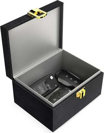 Shows the core product, a luxury storage box containing car key fobs, displayed in an open position to demonstrate its protective storage capability and premium presentation. Highlights the premium…