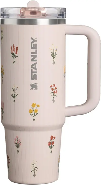 Displays the core product—a Stanley travel mug with a decorative floral pattern—in a clean catalog style to show shoppers the design, branding, and overall appearance of the tumbler.