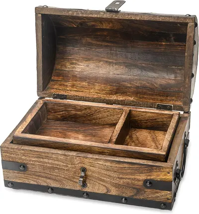 Shows the core wooden treasure chest with its open lid and removable compartment tray so shoppers can see the actual item and interior layout. Grounds the chest with a subtle shadow on a clean…