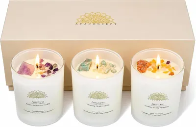 Shows the core three-candle set clearly so shoppers know exactly what they receive in the gift set. Shows the beige branded gift box behind the candles, signaling a ready-to-give presentation.