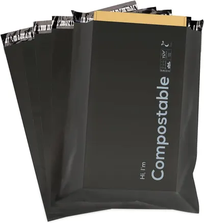 Shows the core compostable black mailer bags stacked together so shoppers can see the bag design and quantity. Reassures buyers that the product is a clean, ready-to-ship mailer. Not applicable