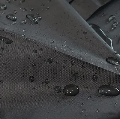 Highlights the product's water-resistant capabilities by showing water droplets on the surface.