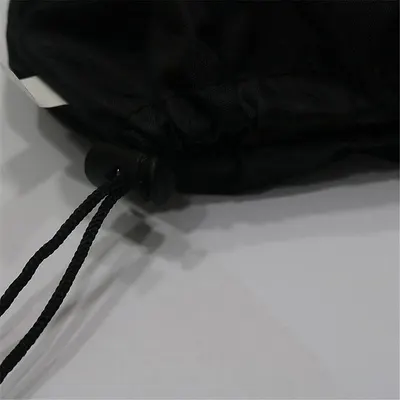 Highlights the drawstring closure feature of the product, likely a bag or clothing item, to showcase its adjustability and secure fit.