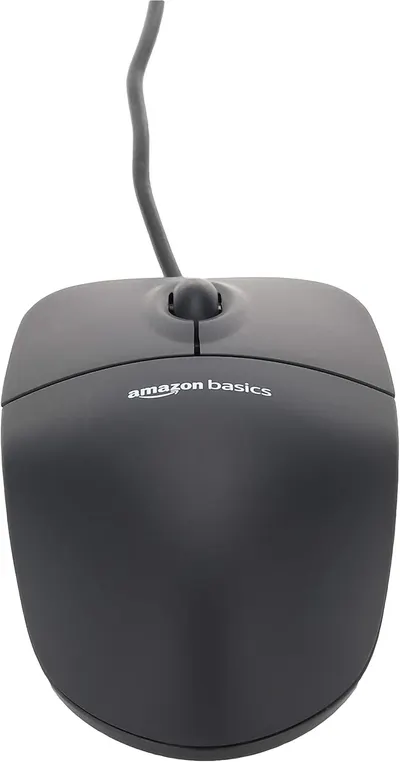 Shows the product, an Amazon Basics computer mouse, in a simple lifestyle context without any additional text or feature callouts.